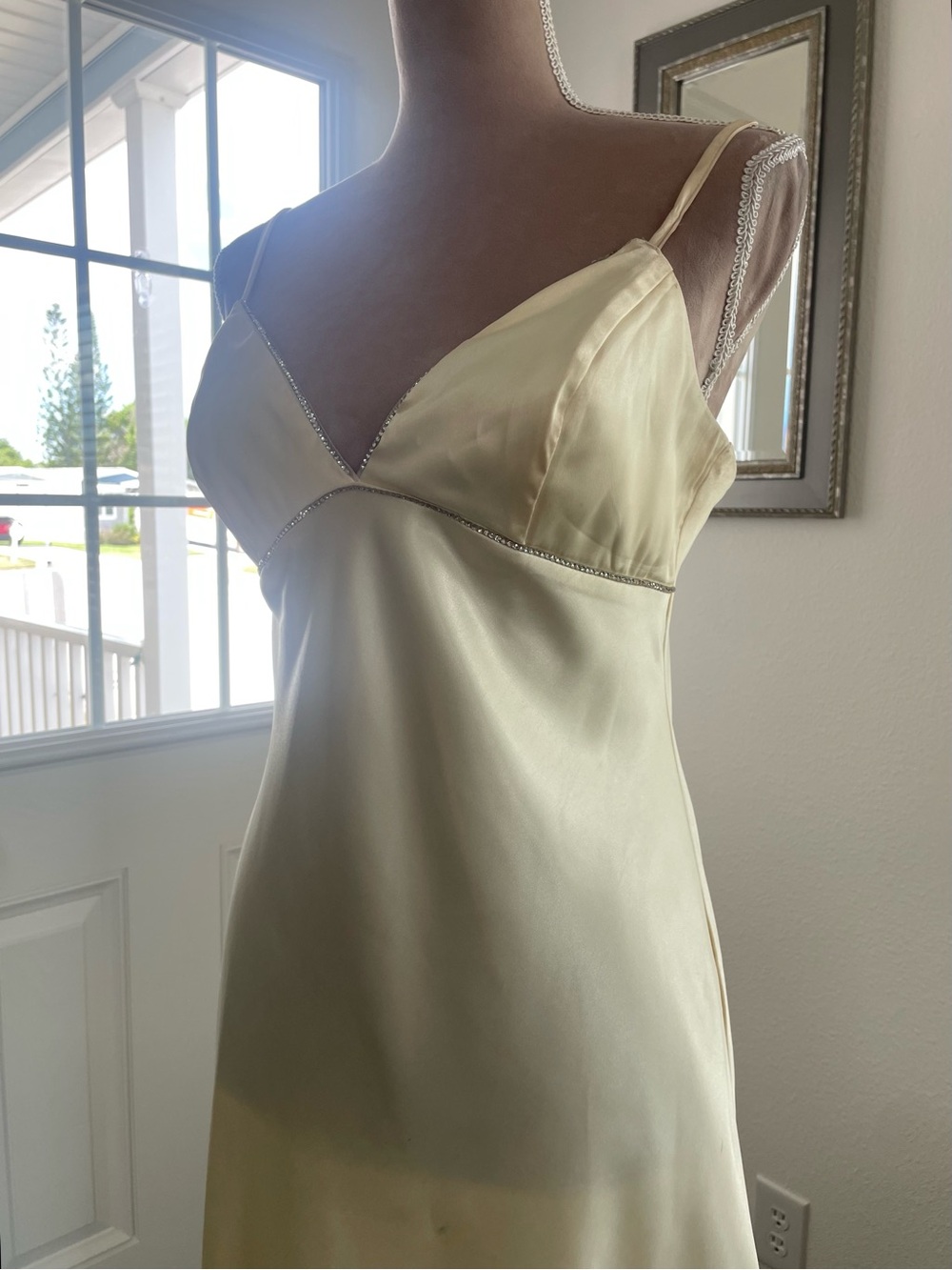 Morgan & Company Silky Ivory Dress with Delicate rhinestone like trim at bodice.